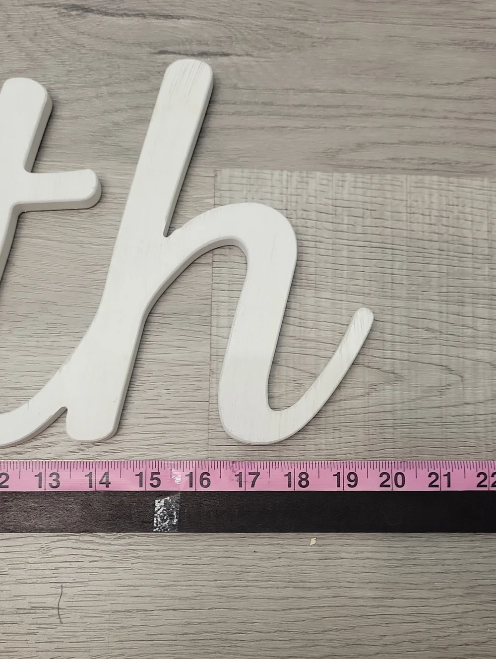 White cursive BATH wooden wall decor sign